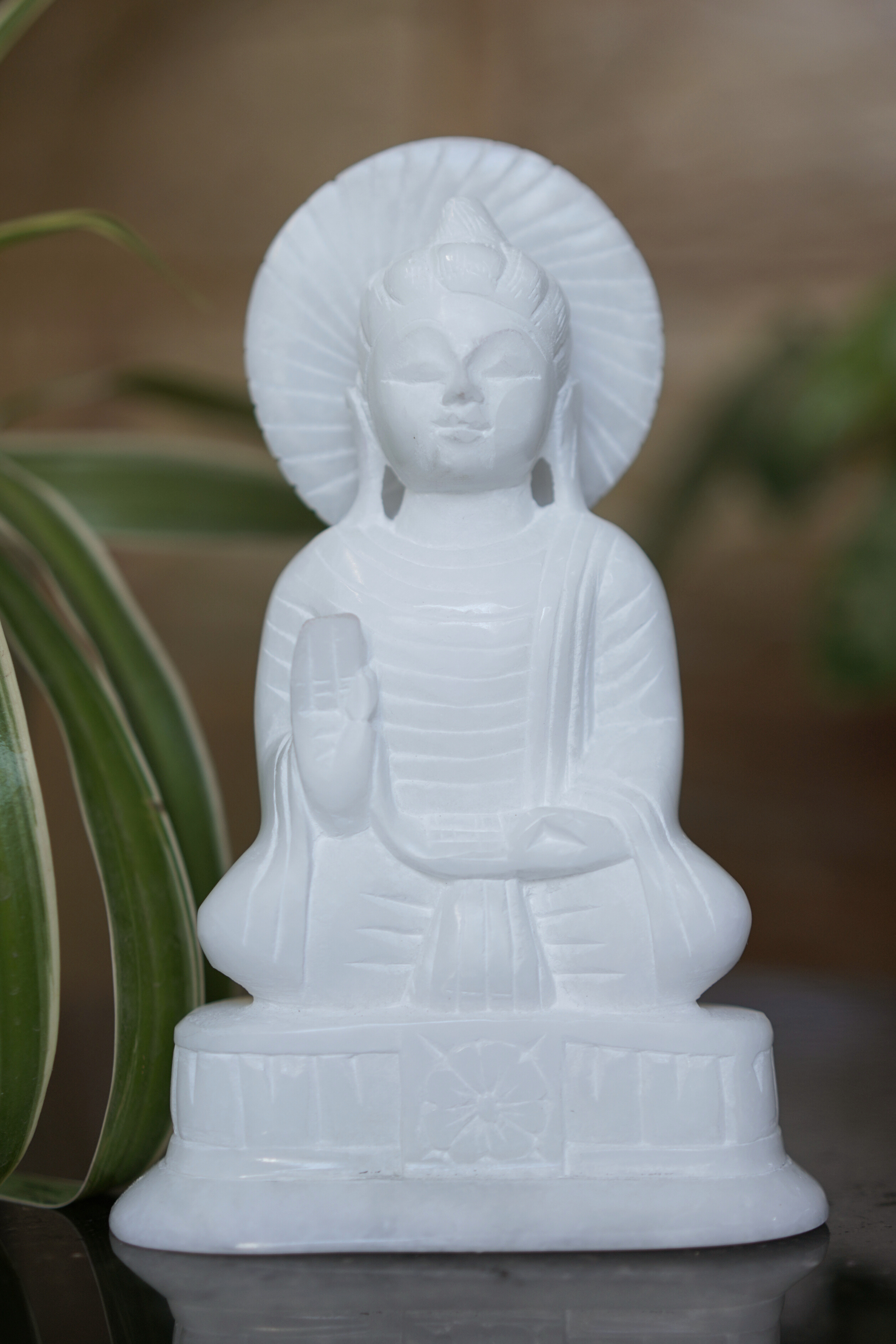 White Stone Buddha With 'Dharma' Wheel