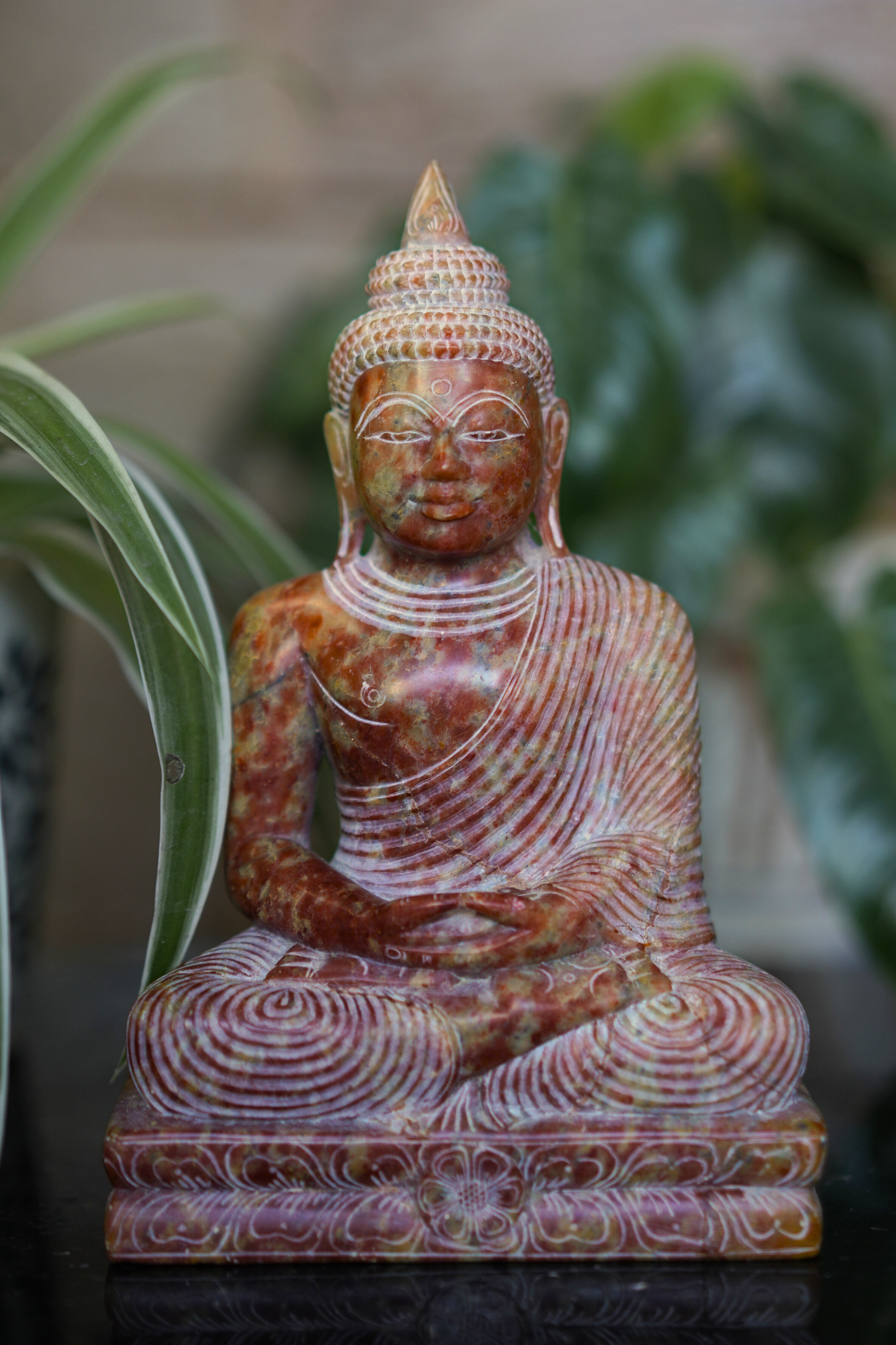 Stone meditating Buddha